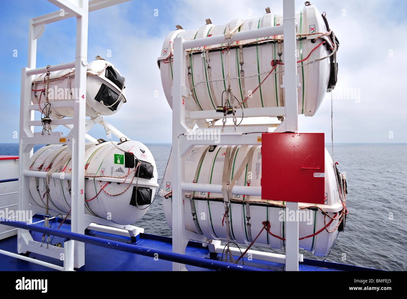 Inflatable liferafts in hardshelled canisters and lifeboat on board of