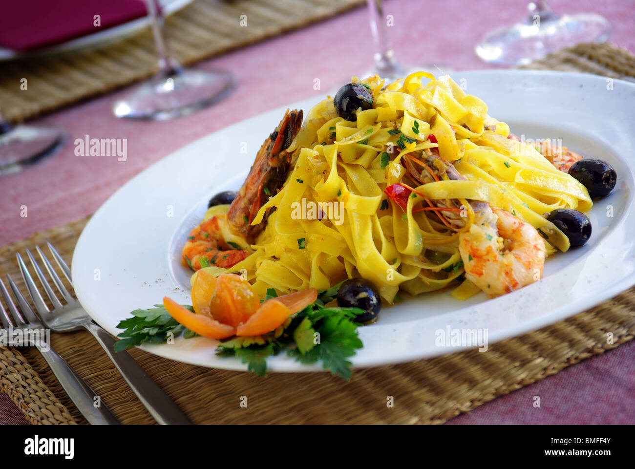 Italian dish of tagliatelle, shrimps and olives Stock Photo