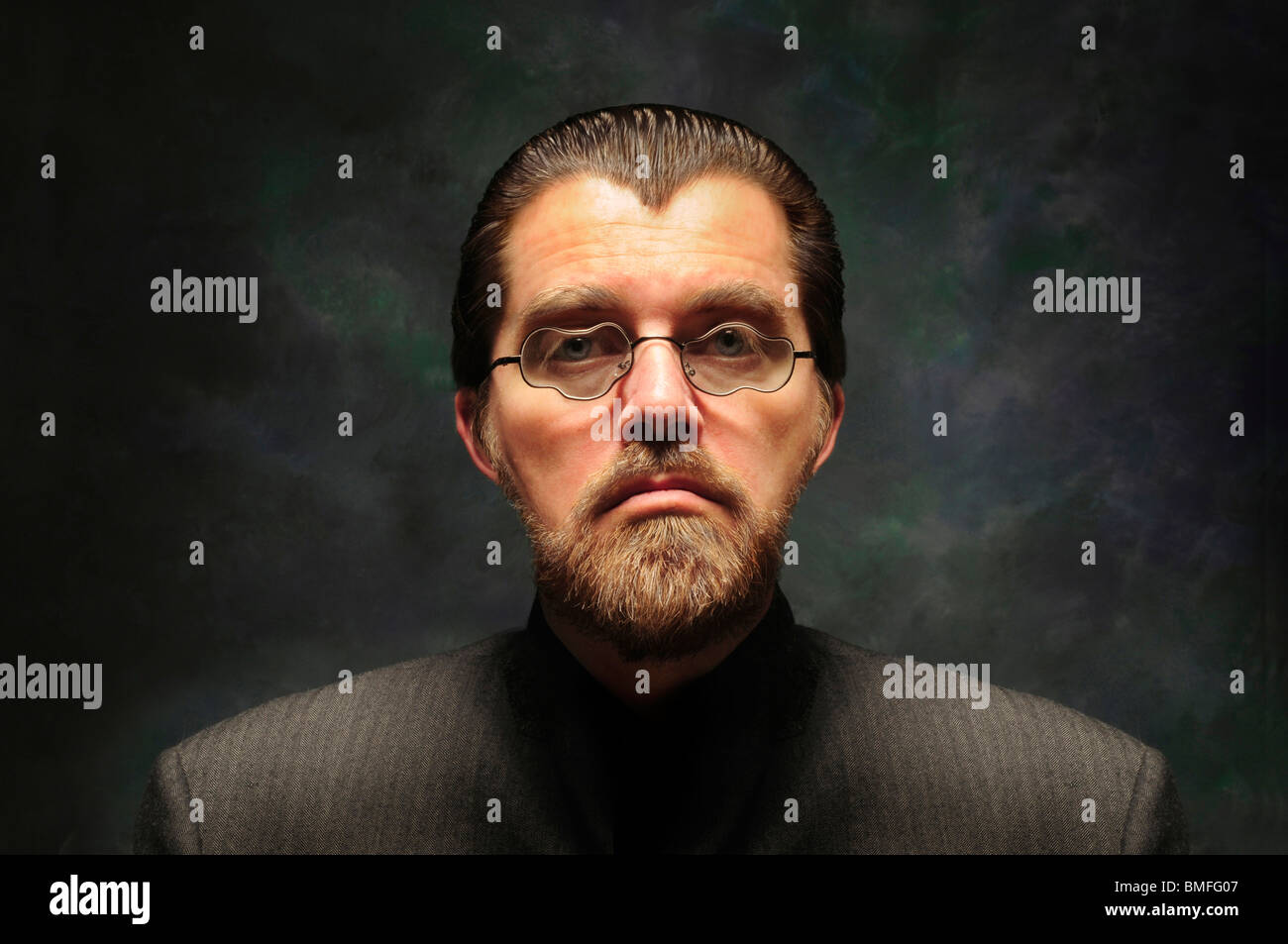 Orwellian character with distorted misshapen glasses and beard against a dark background Stock Photo