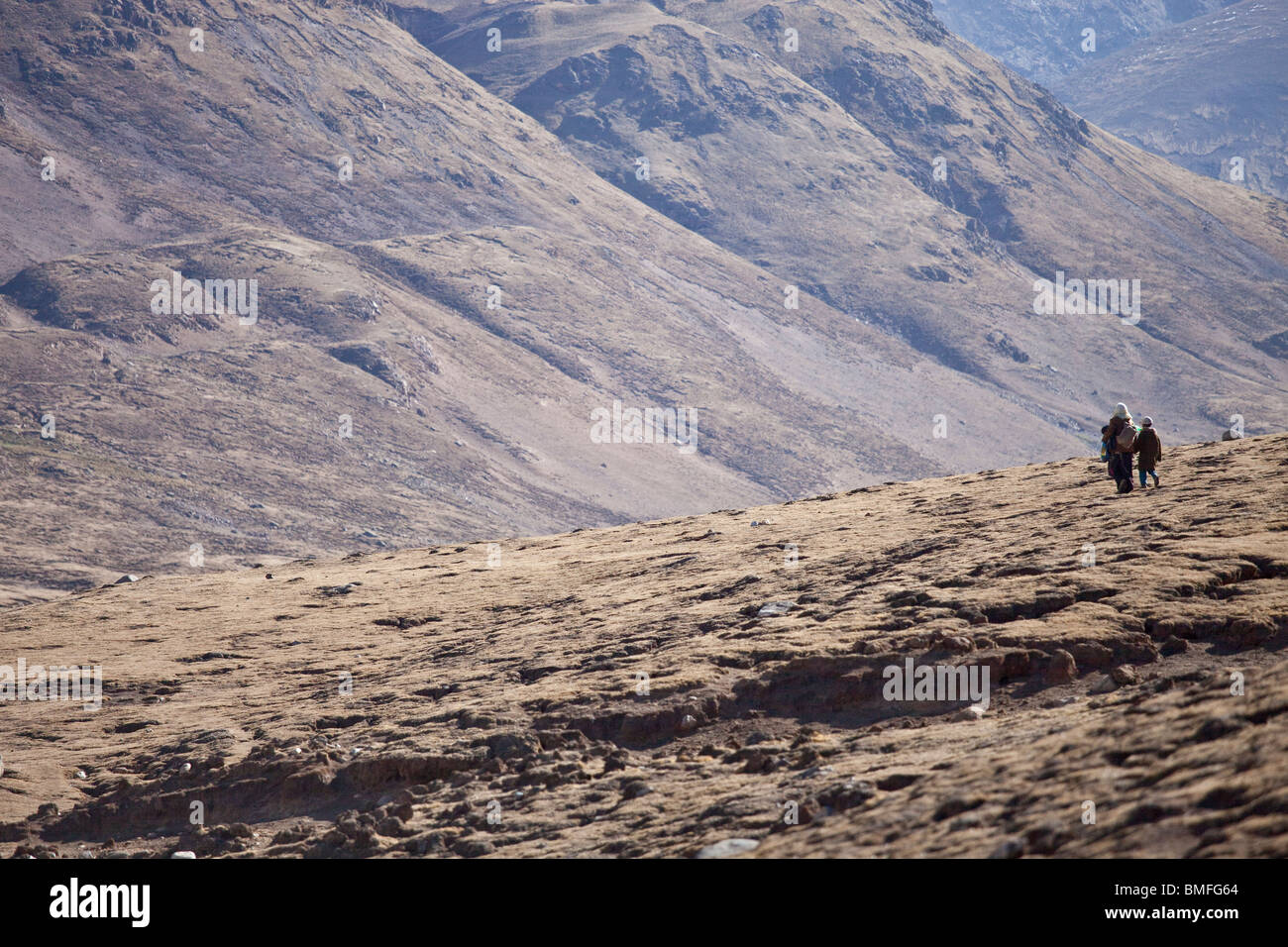 Mother and son in the mountains near Nam-tso Lake in Tibet Stock Photo