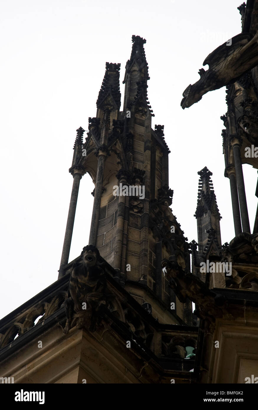 Gargoyles, spires and gothic ornamentation on the buttress of St Vitas Cathedral in Prague Castle Stock Photo