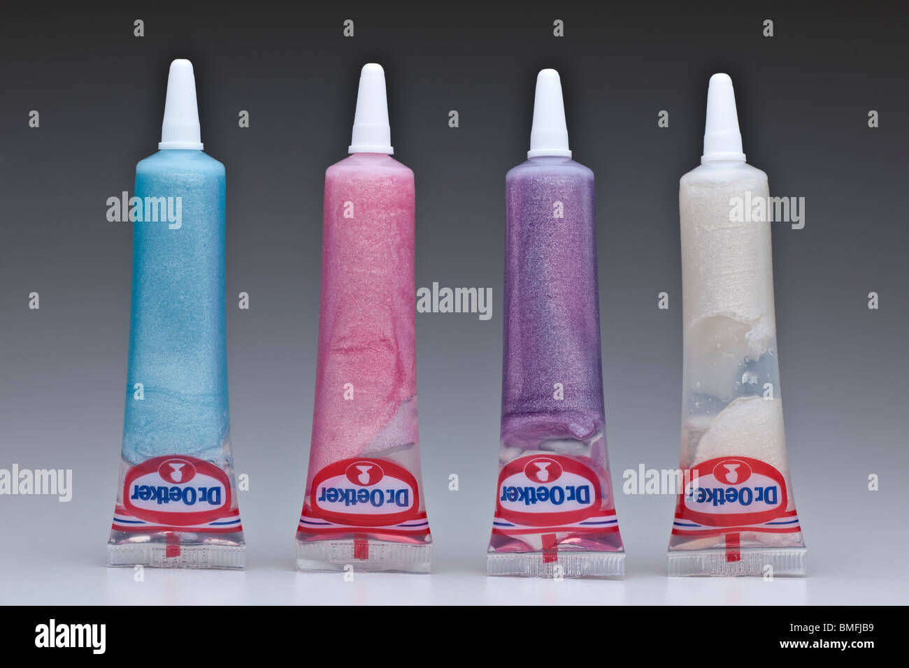 Four plastic tubes of Dr Oetker coloured icing gels Stock Photo