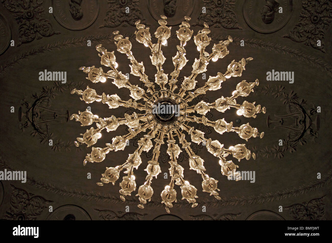 Crystal Chandelier Hanging In A Classically Decorated Room