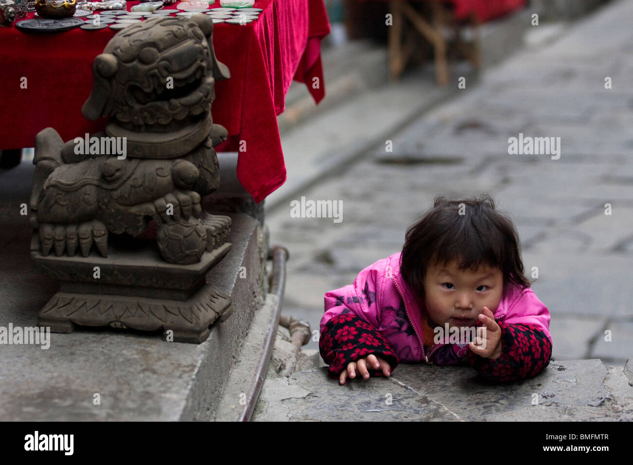 Little girl looking at camera, Furong Town, Yongshun County, Xiangxi Tujia and Miao Autonomous Prefecture, Hunan Province, China Stock Photo