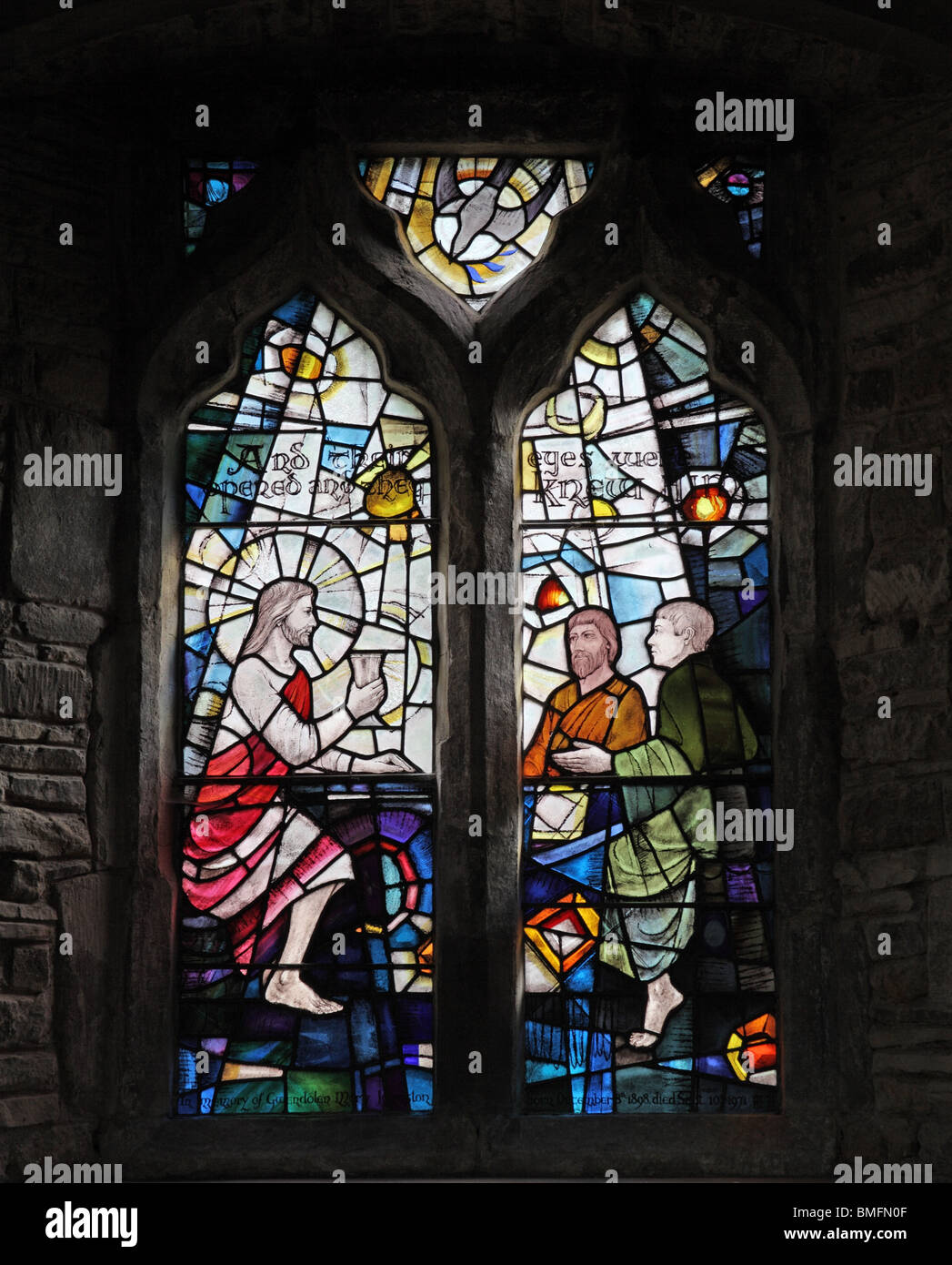 A stained glass window of 1974 by Roger Fifield depicting Supper at Emmaus, Church of St Peter & St Paul, Wing, Rutland Stock Photo