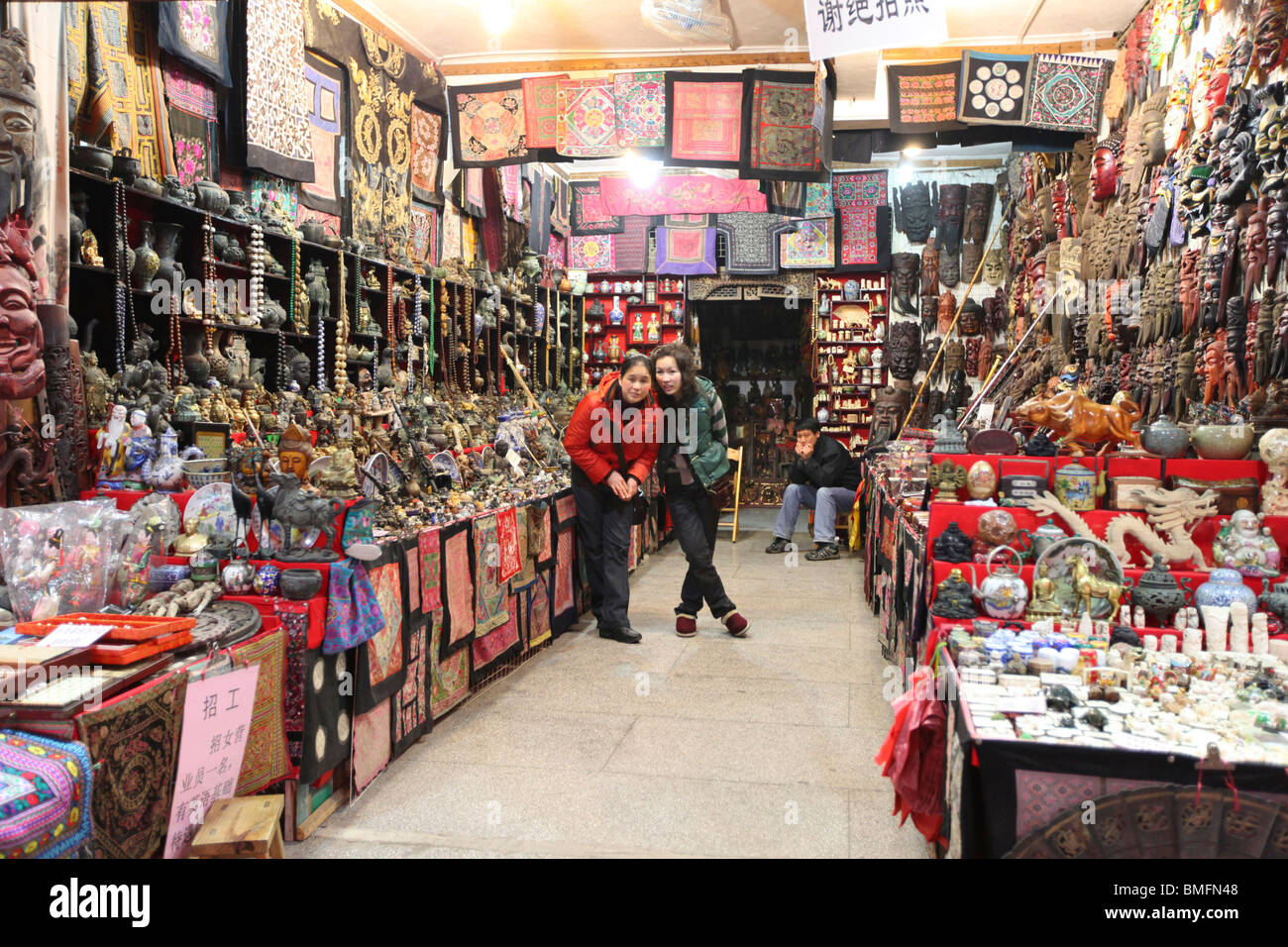 Clerks looking at camera in souvenir store, West Street, Yangshuo County,  Guilin, Guangxi Province, China Stock Photo - Alamy