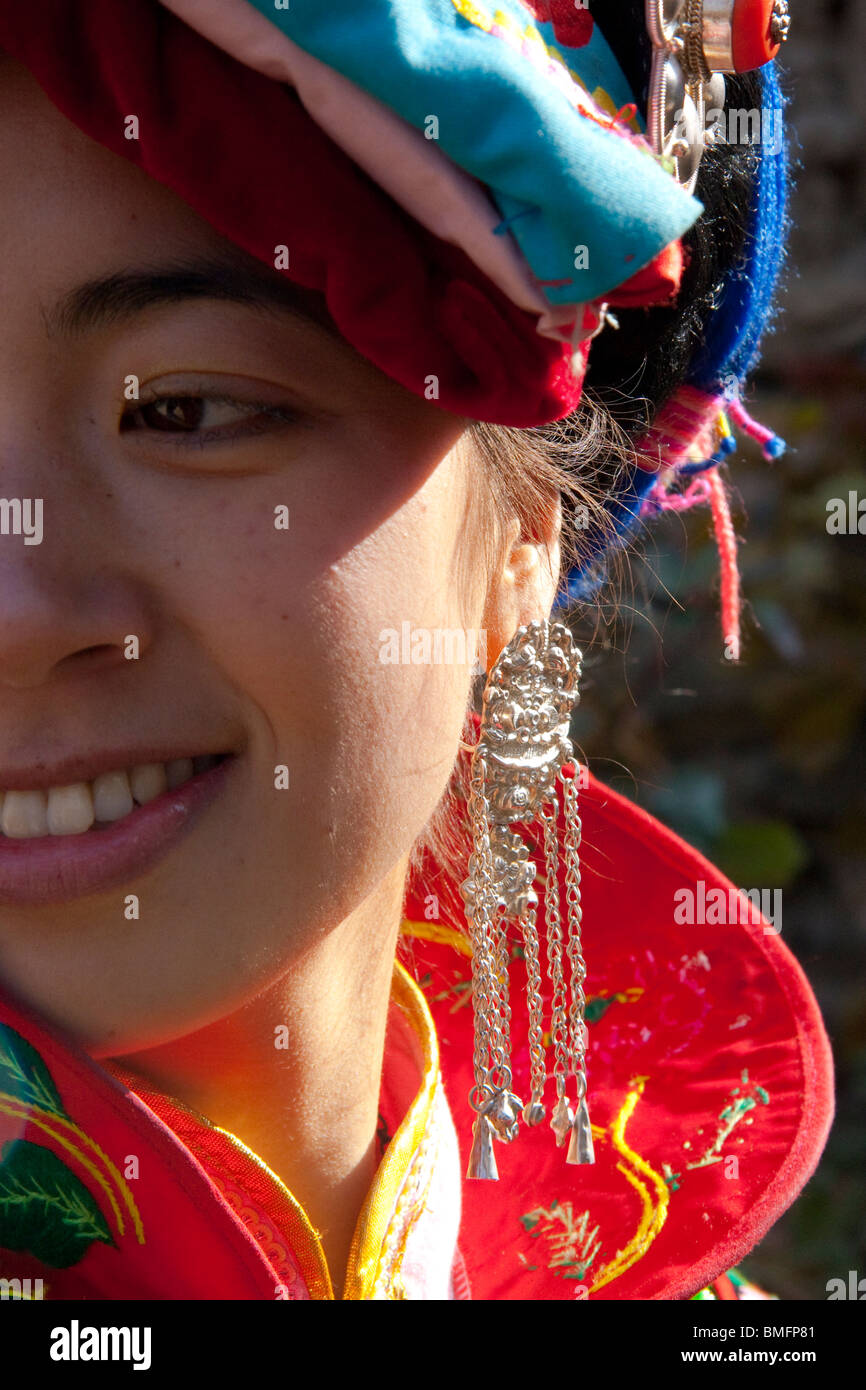 Qiang young woman with elaborate silver earring, Yingxiu, Wenchuan, Sichuan Province, China Stock Photo