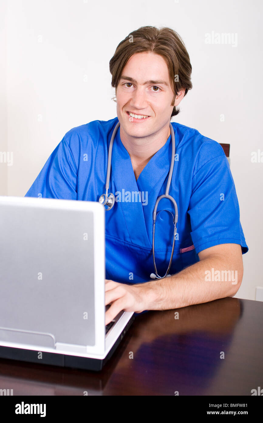 male nurse using laptop computer Stock Photo