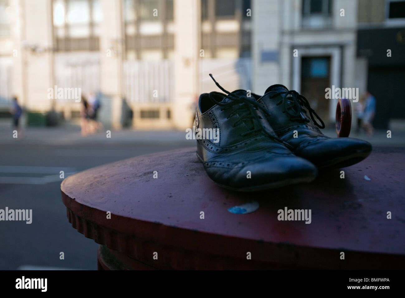 shoes on top of a london post box Stock Photo