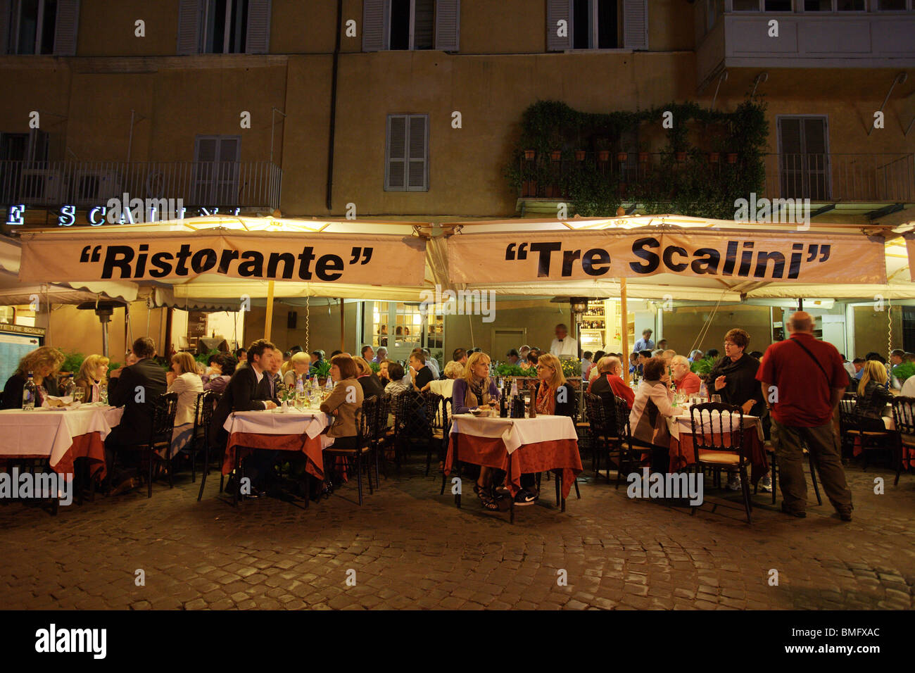 Typical restaurant pizzeria "Tre Scalini" with people eating in the street.  Piazza Navona Rome Italy Stock Photo - Alamy