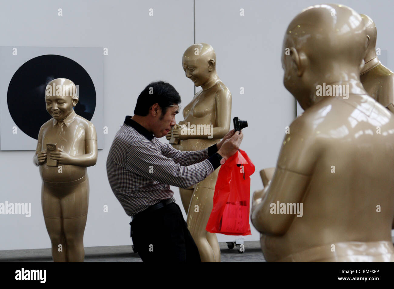 Man take photos of modern art statue, 798 Art District, Beijing, China Stock Photo