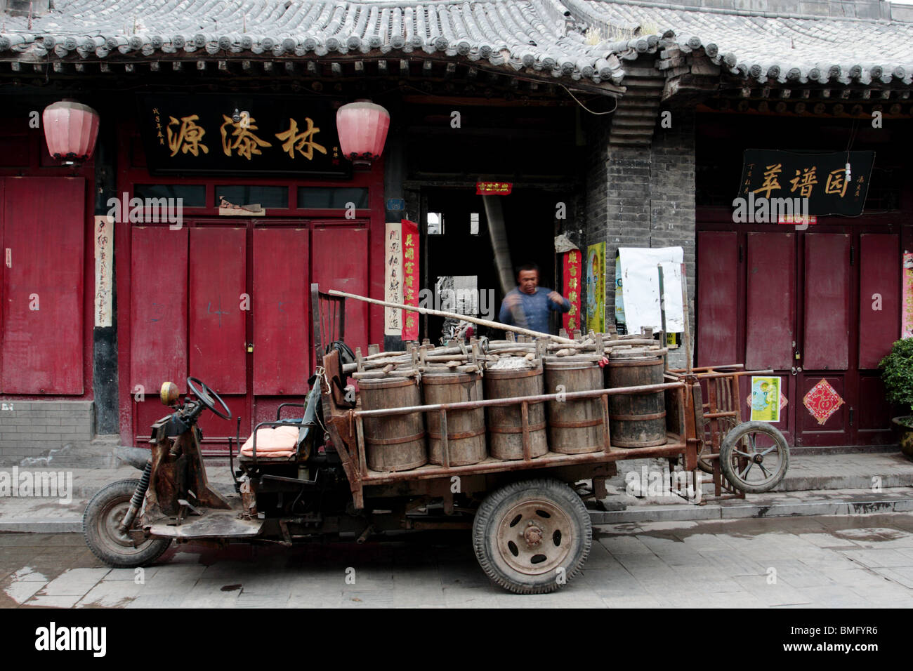 Cart carrying wooden manure buckets, Ancient MingQing Street, Pingyao, Shanxi Province, China