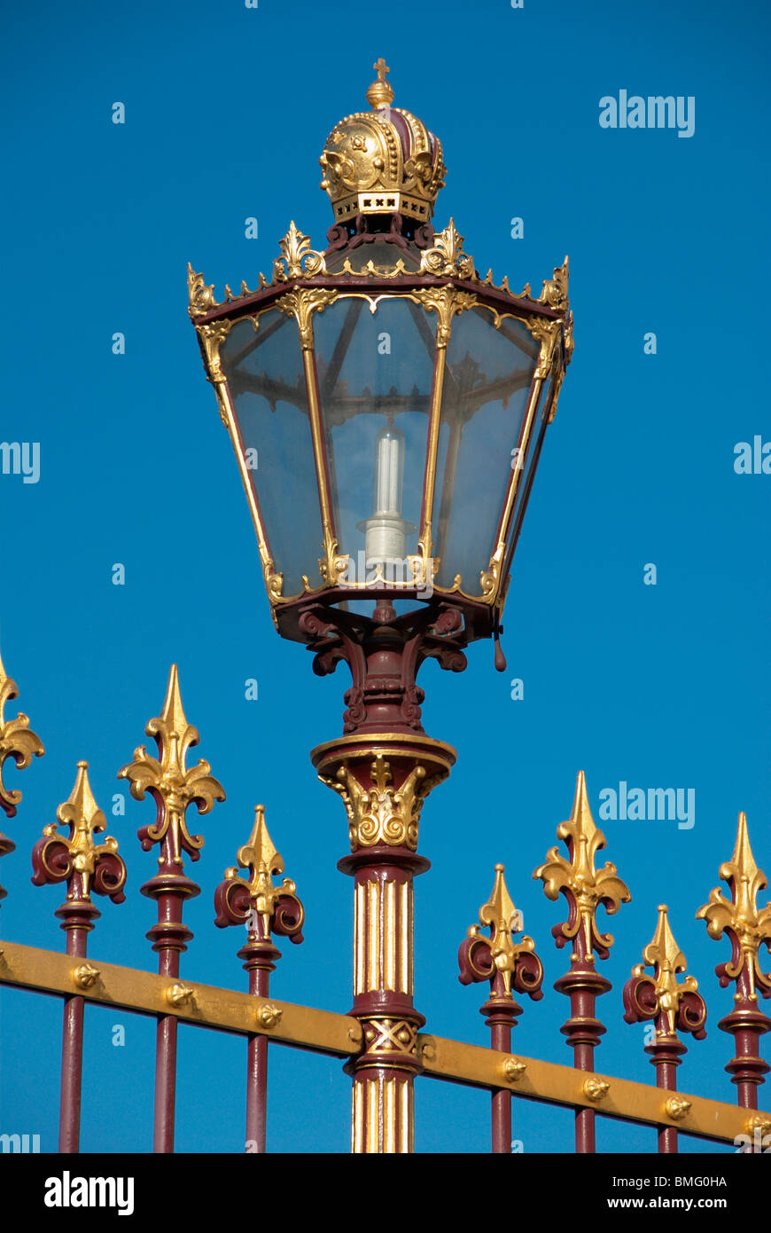 Gold-plated lamp at the fence of the Vienna Hofburg Stock Photo