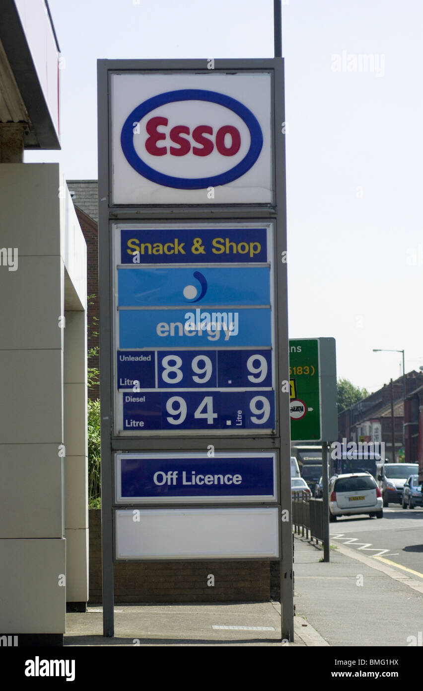 An Esso petrol station price board UK Stock Photo