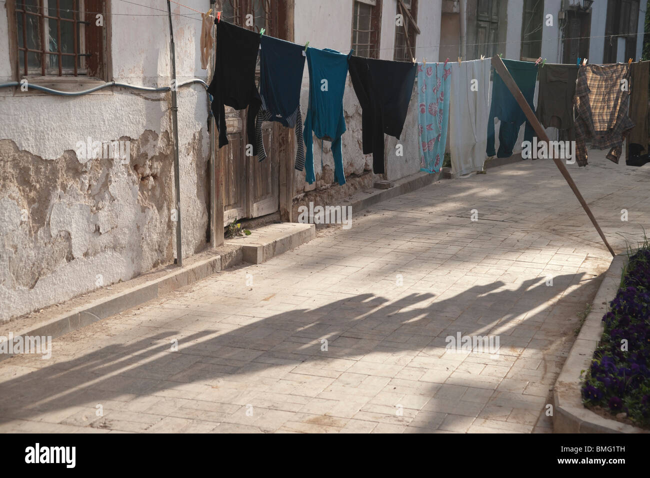 Turkey Antalya - clothes line blocking a street in the old city Stock Photo