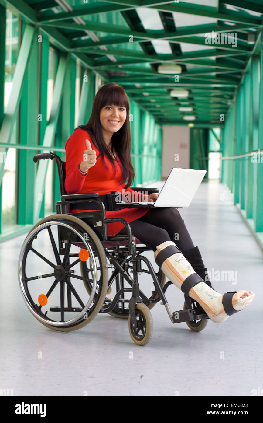 Young woman with leg in plaster Stock Photo