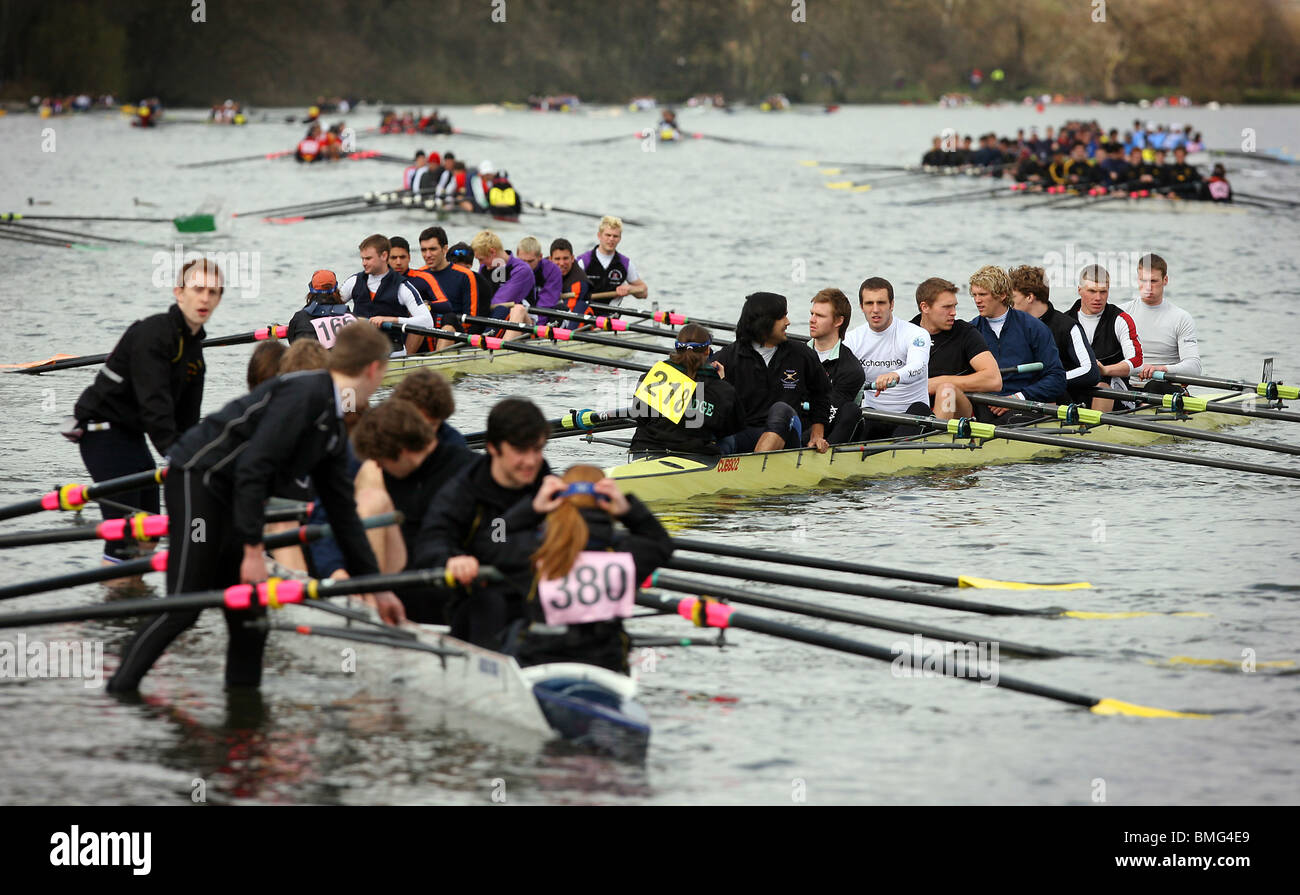 Eight rowing crews row towards the start of the mens Head of The River Race in London. Stock Photo