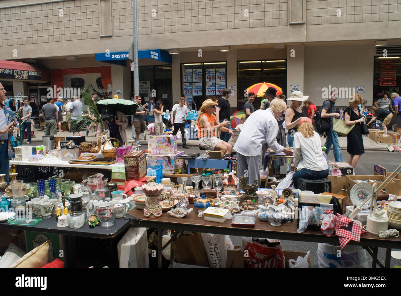 Shoppers search for bargains at a flea market in the New York neighborhood of Chelsea Stock Photo