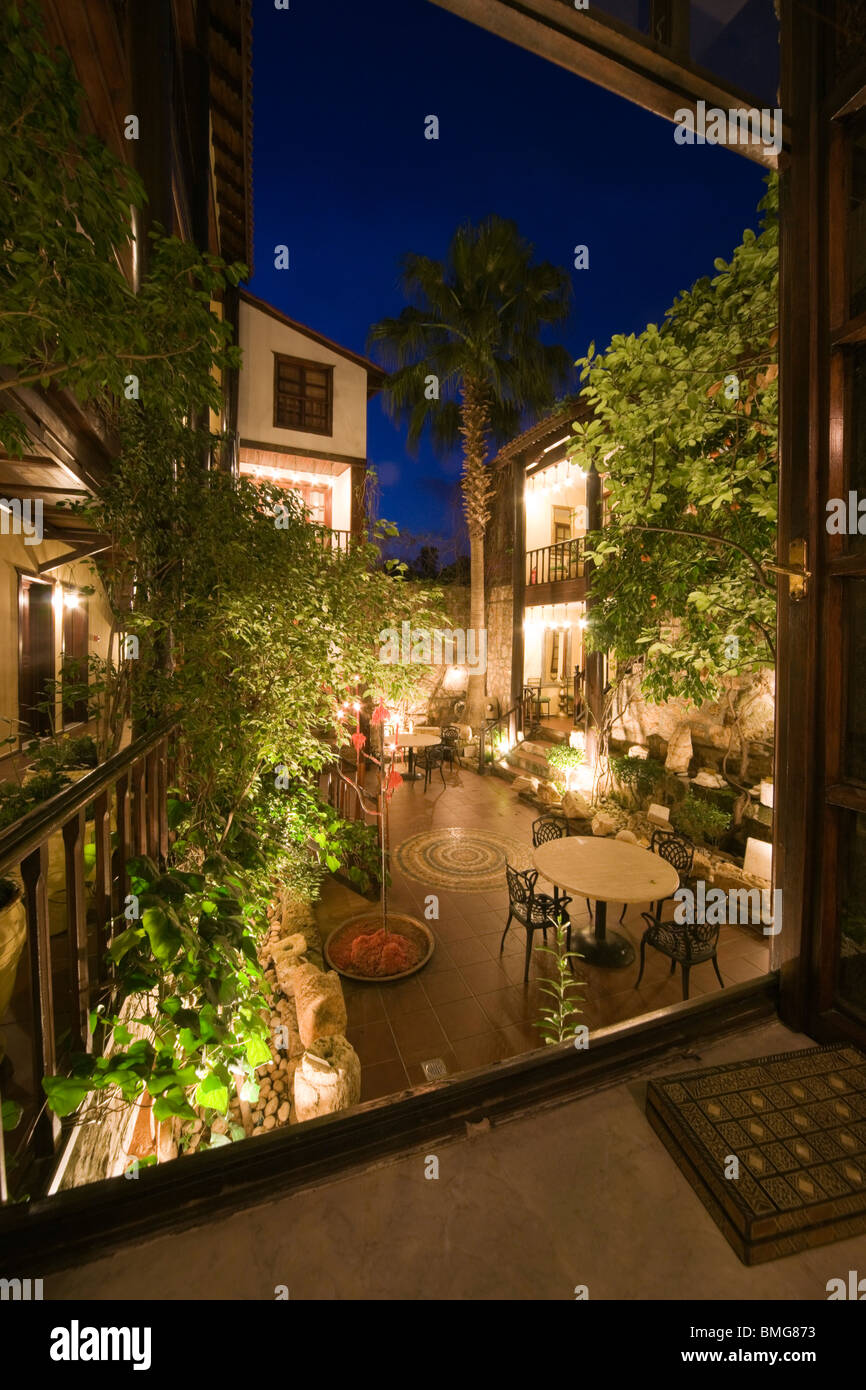 Turkey Antalya - the Hotel Alp Pasha, Ottoman boutique hotel in old city - courtyard by cande light Stock Photo