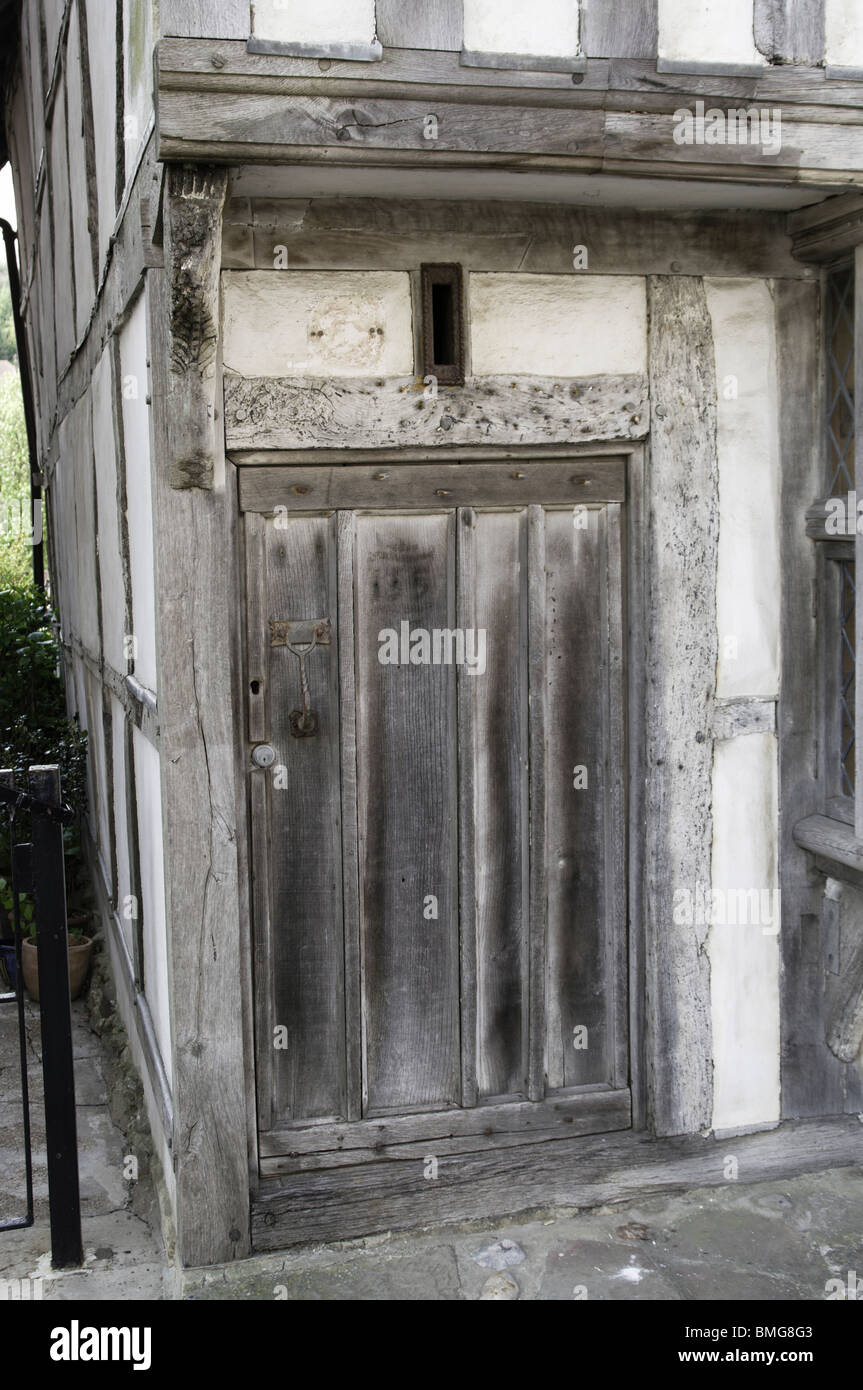 An old historic wooden doorway on a Tudor house in All Saints street Hastings east Sussex England Stock Photo