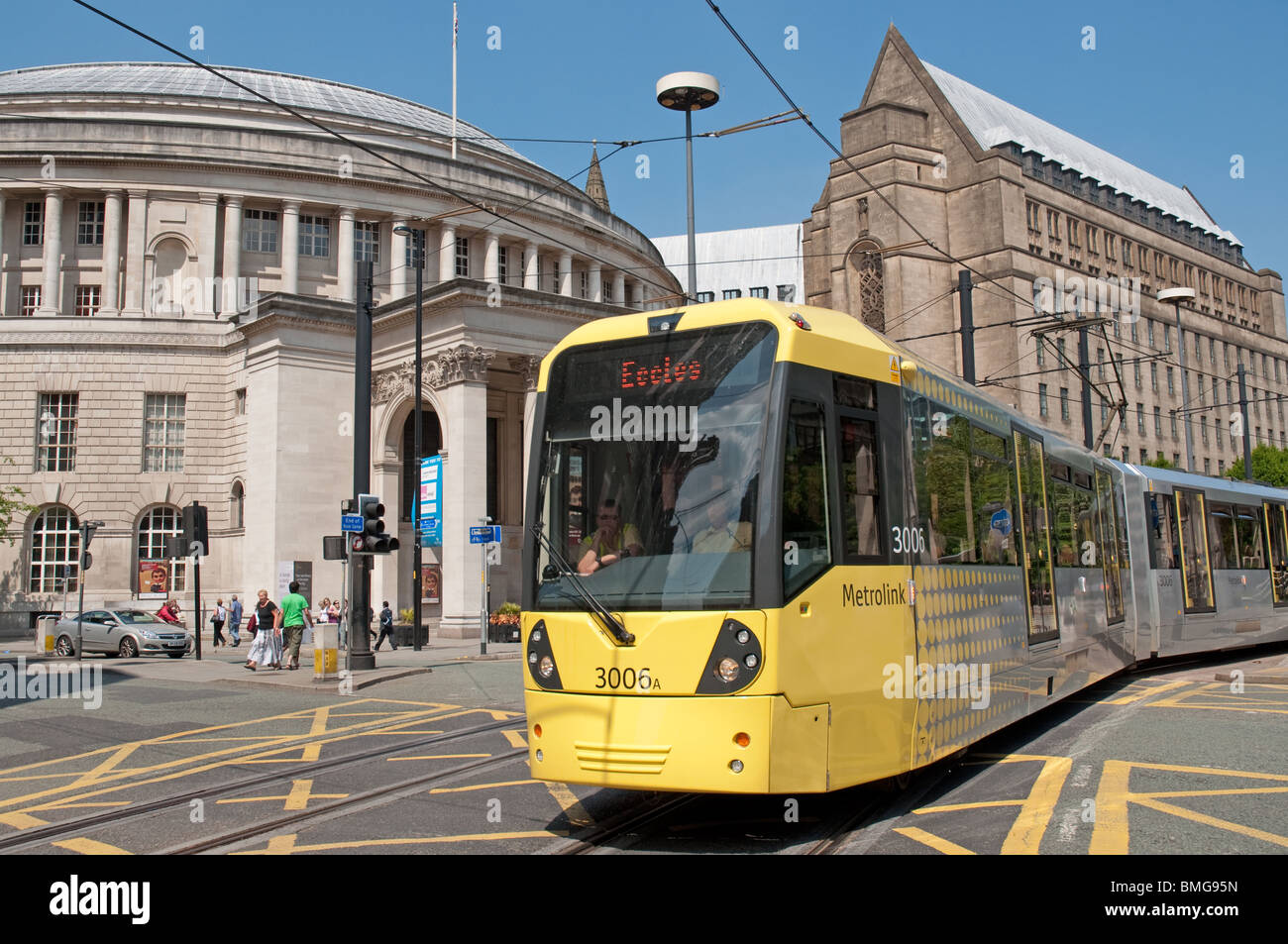 Metrolink tram in St Peter's Square,Mancheser,UK.Central library in the background. Stock Photo