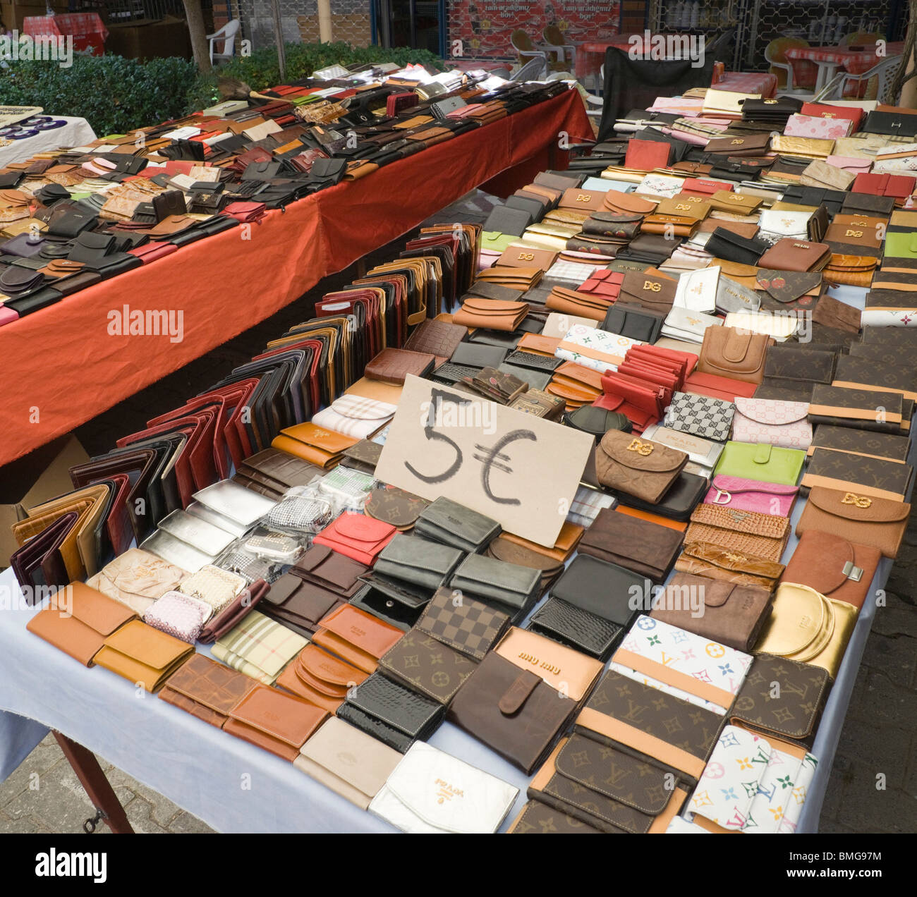 Fake luxury purses are sold on a sidewalk in downtown Guiyang, the capital  of China's Guizhou Province, on May 2, 2015. China remains the largest  manufacturer and supplier of counterfeit luxury goods