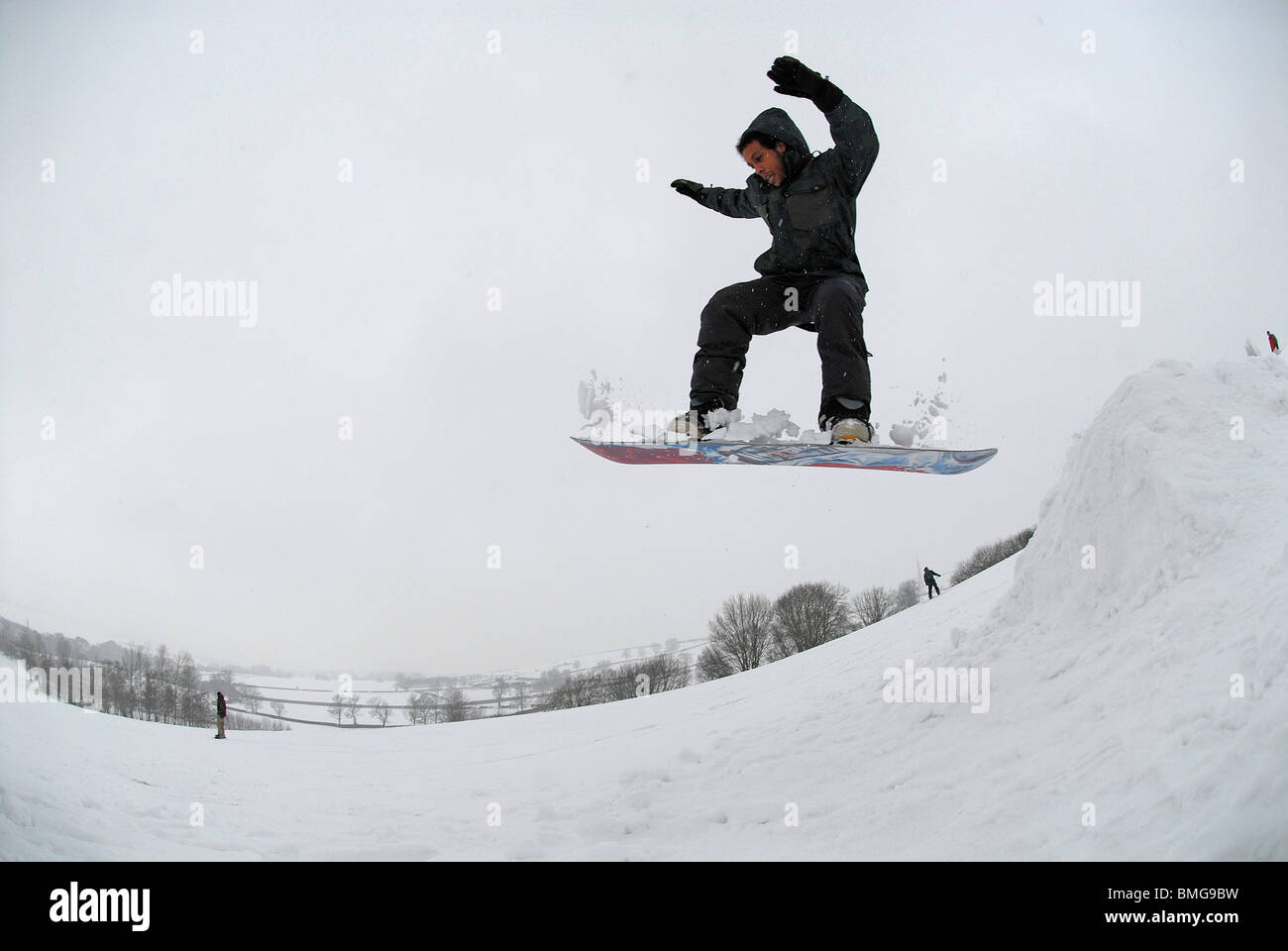 A Snowboarder Using The Impromtu Ski Slope And Ski Lift At Cold Ashby Golf Club 