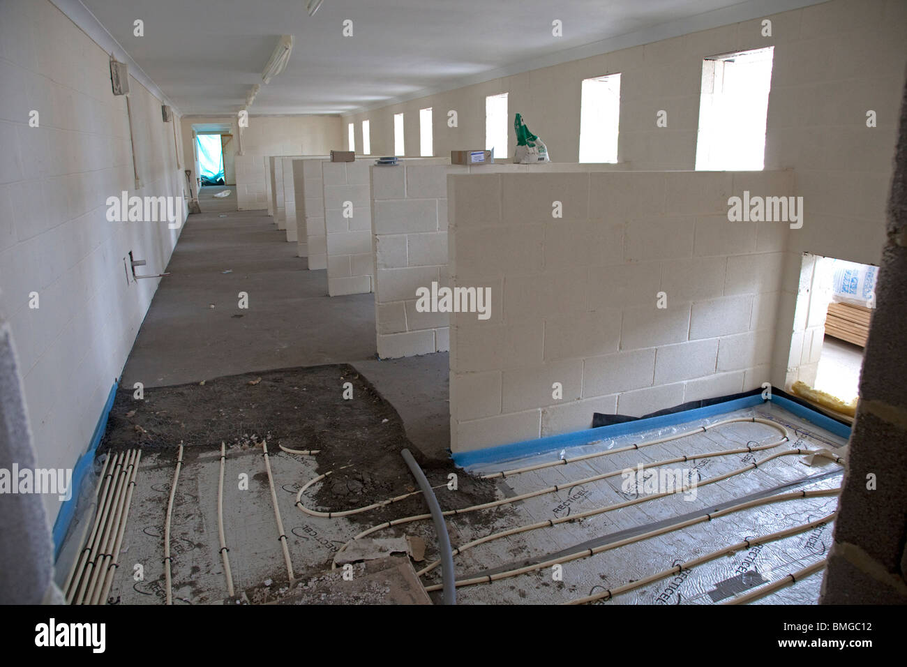 Installing underfloor heating pipes in new kennels building Cheltenham