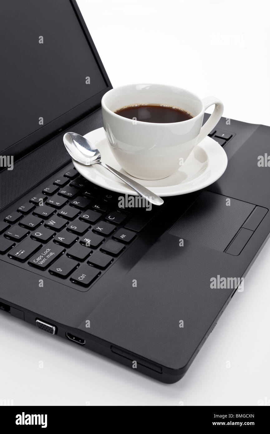 Coffee cup and computer close up Stock Photo - Alamy