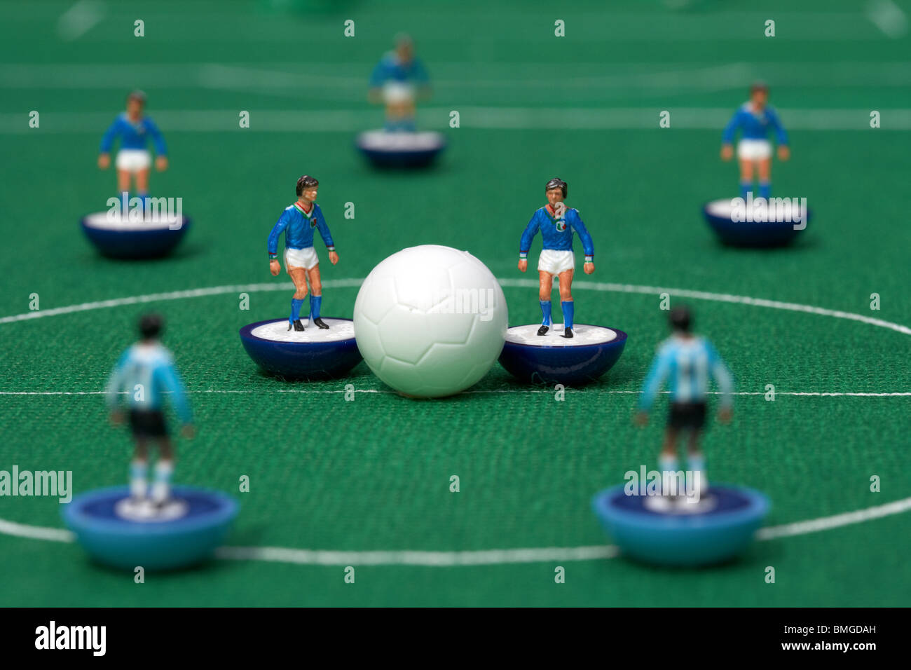 kick off or restart football soccer scene reinacted with subbuteo table top football players game Stock Photo