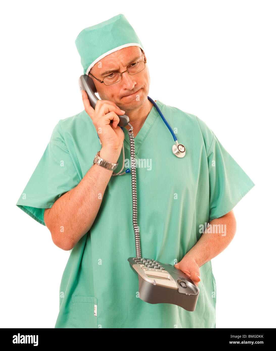 Surgeon on Telephone dressed in green scrubs on white background Stock ...