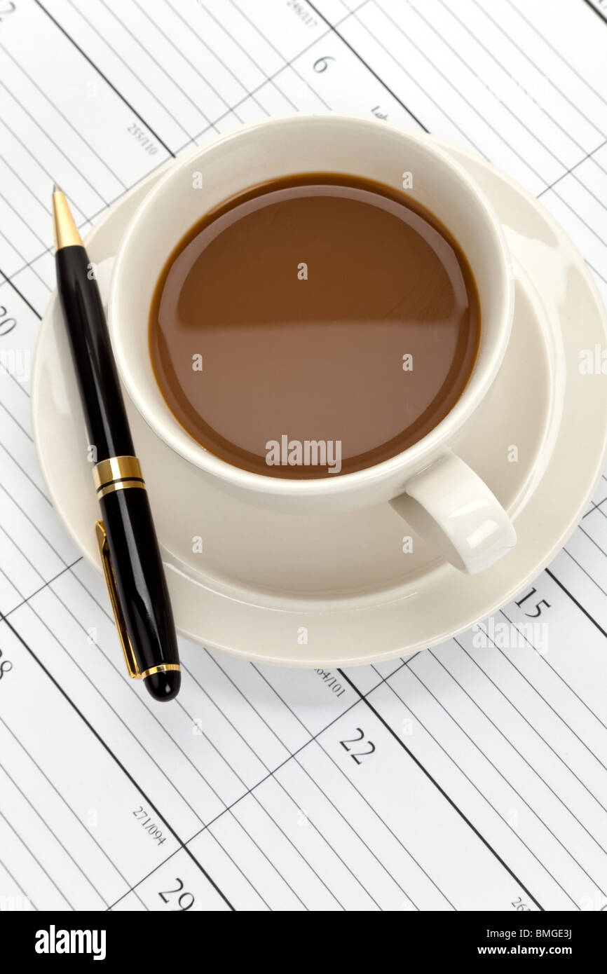Coffee cup and Calendar close up Stock Photo Alamy
