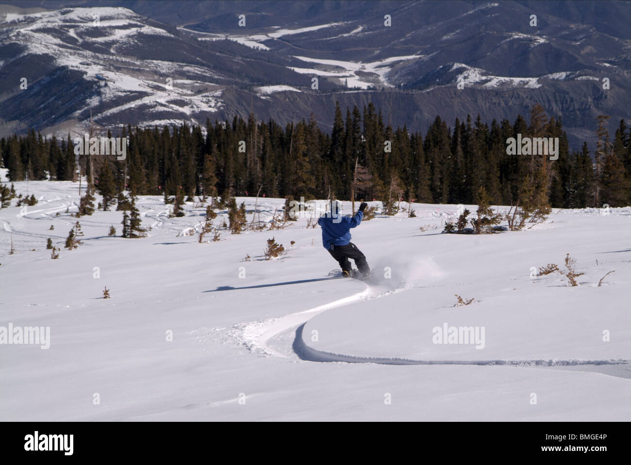 Man snowboarding downhill. Stock Photo