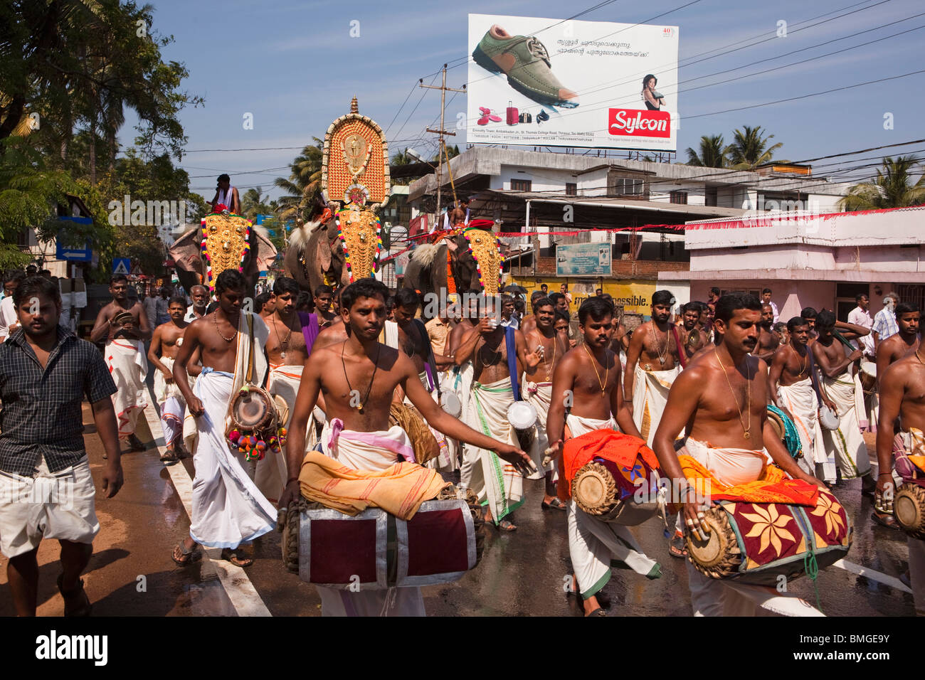 India, Kerala, Thrissur, procession of three caparisoned temple elephants on road to KoorkancherryThaipooya Mahotsavam festival Stock Photo