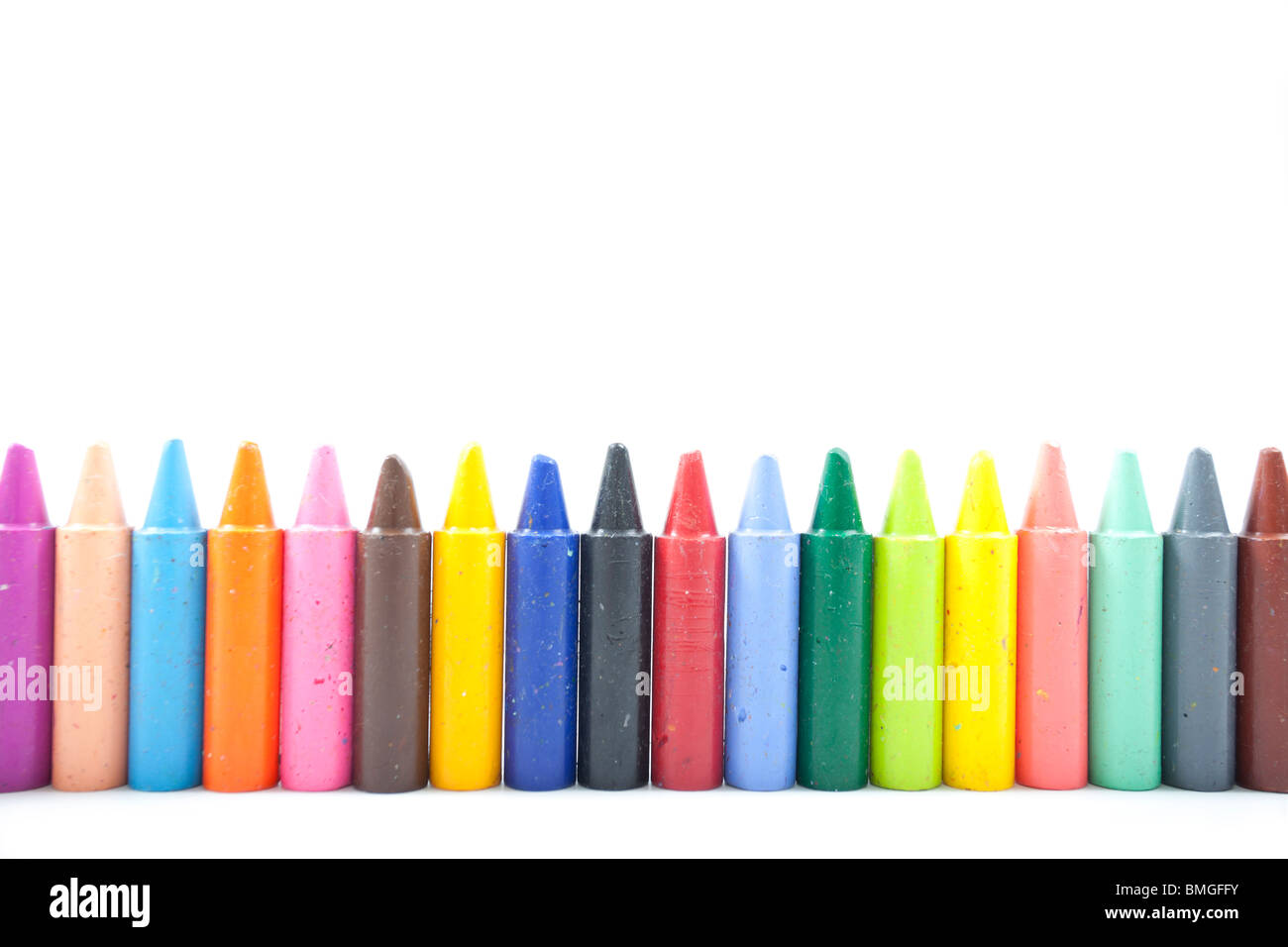 line of wax crayons on white background Stock Photo