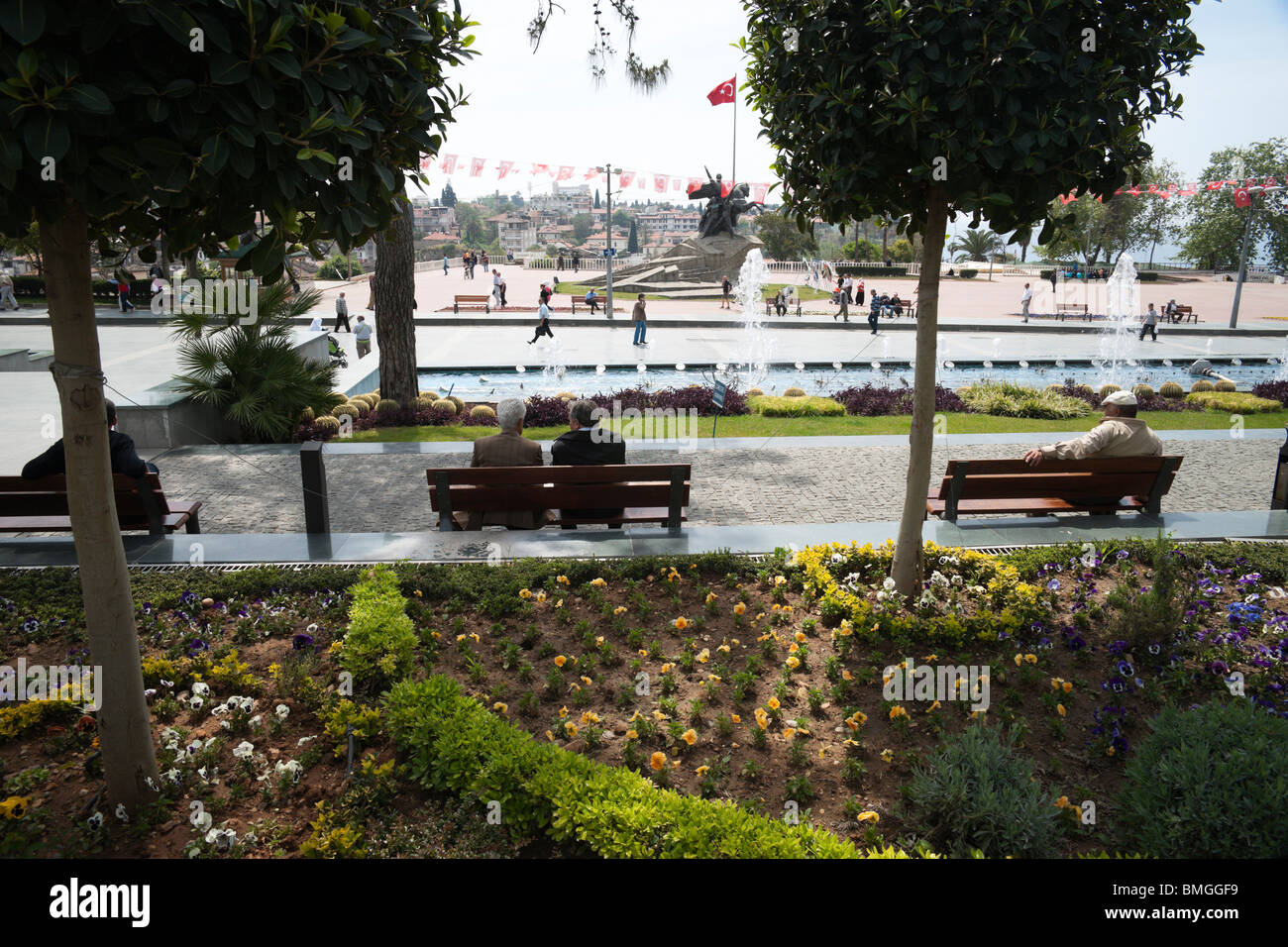 Turkey Antalya Cumhuriyet Square local people relax with fountains and water features Stock