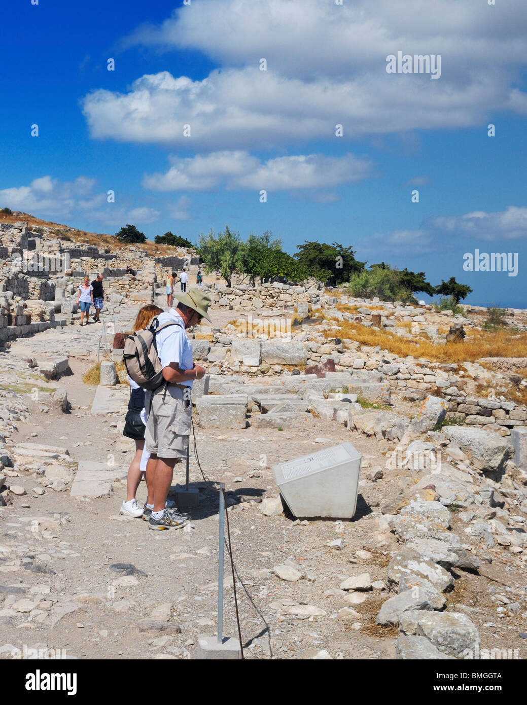 Visitors at the ruins of the ancient city of Thera on top of Mount Mésa Vounó, Santorini Island, Greece. Stock Photo