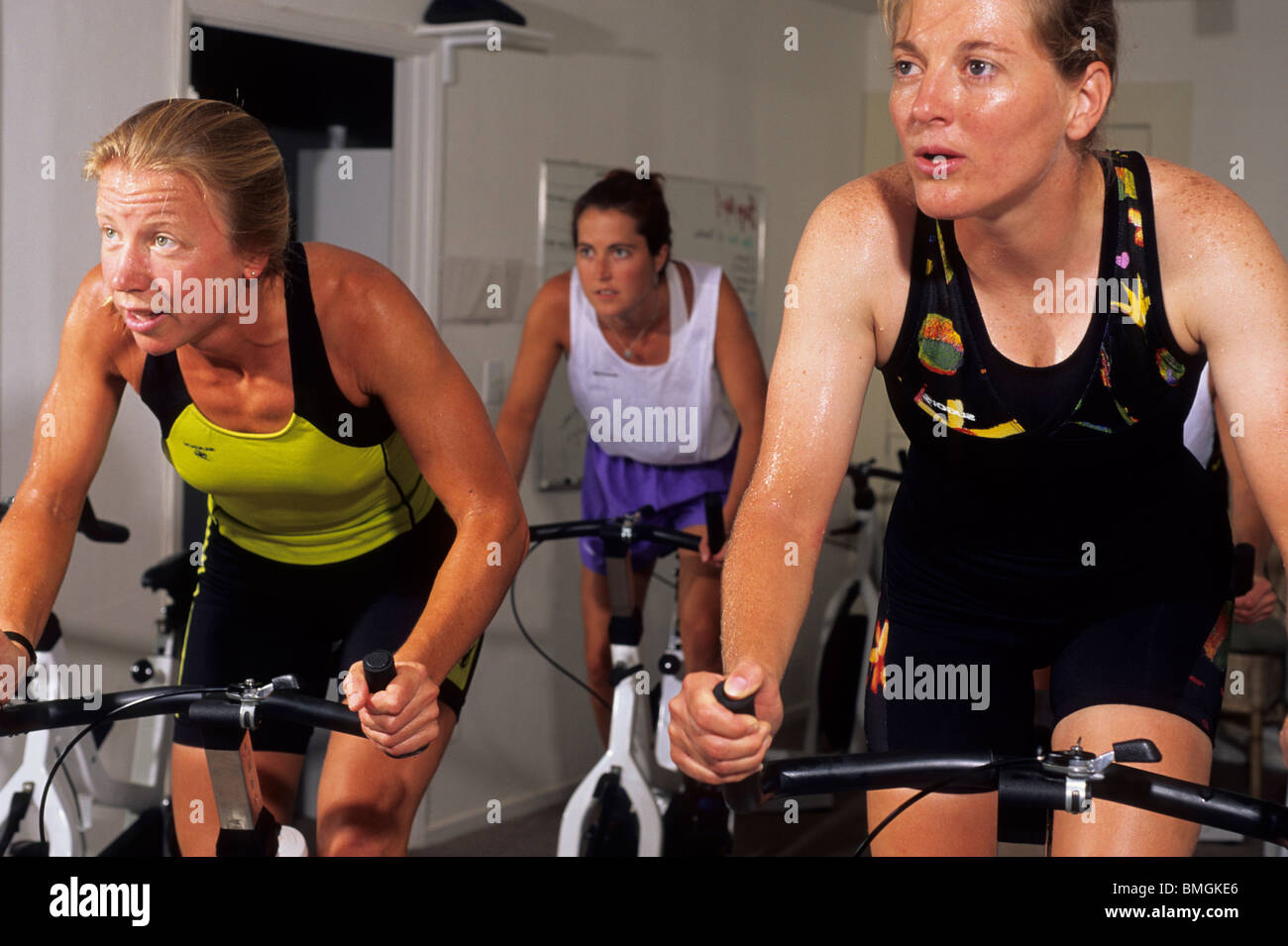People in a spinning class at the gym. Stock Photo