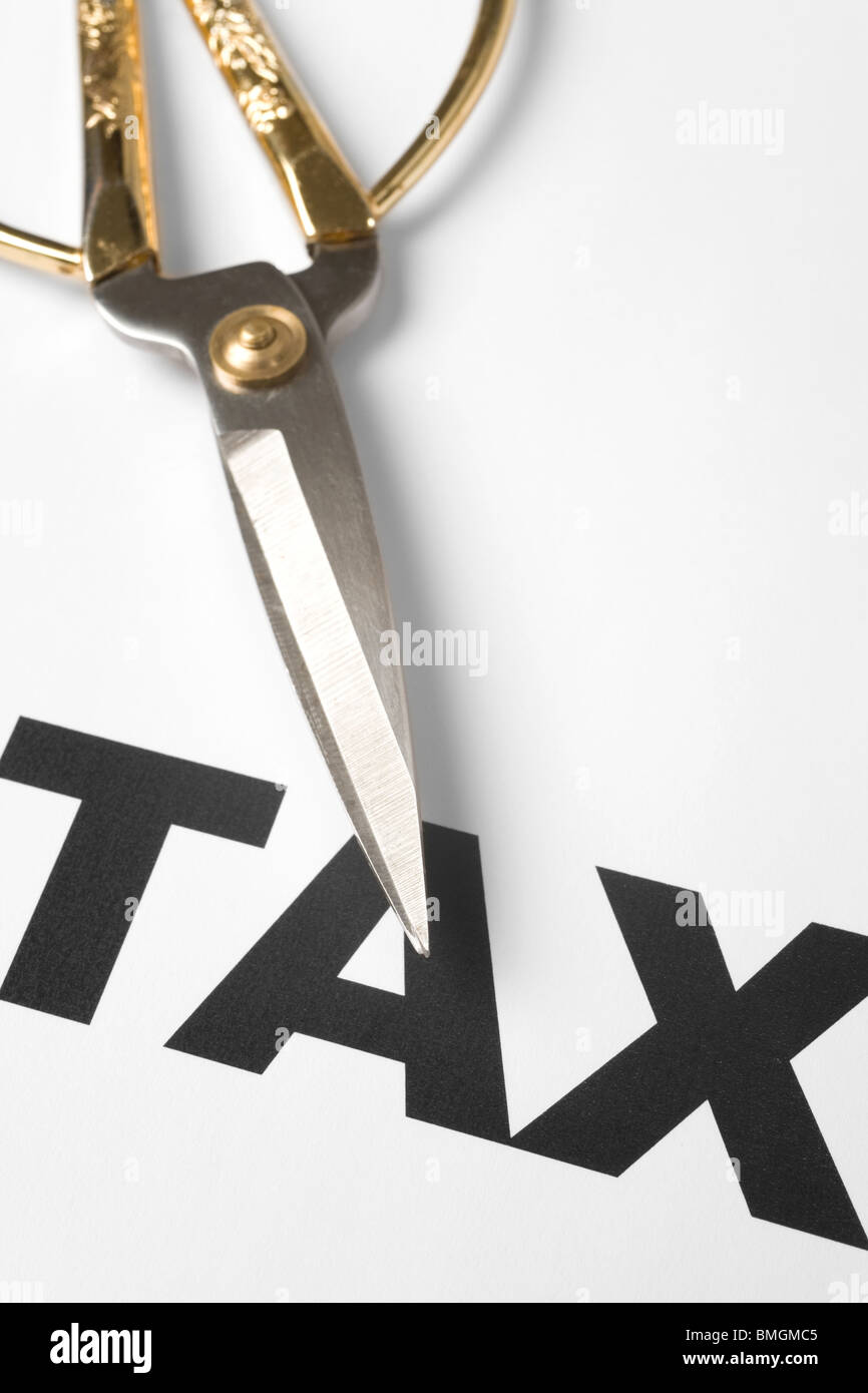 text of tax and scissors, concept of tax cut Stock Photo