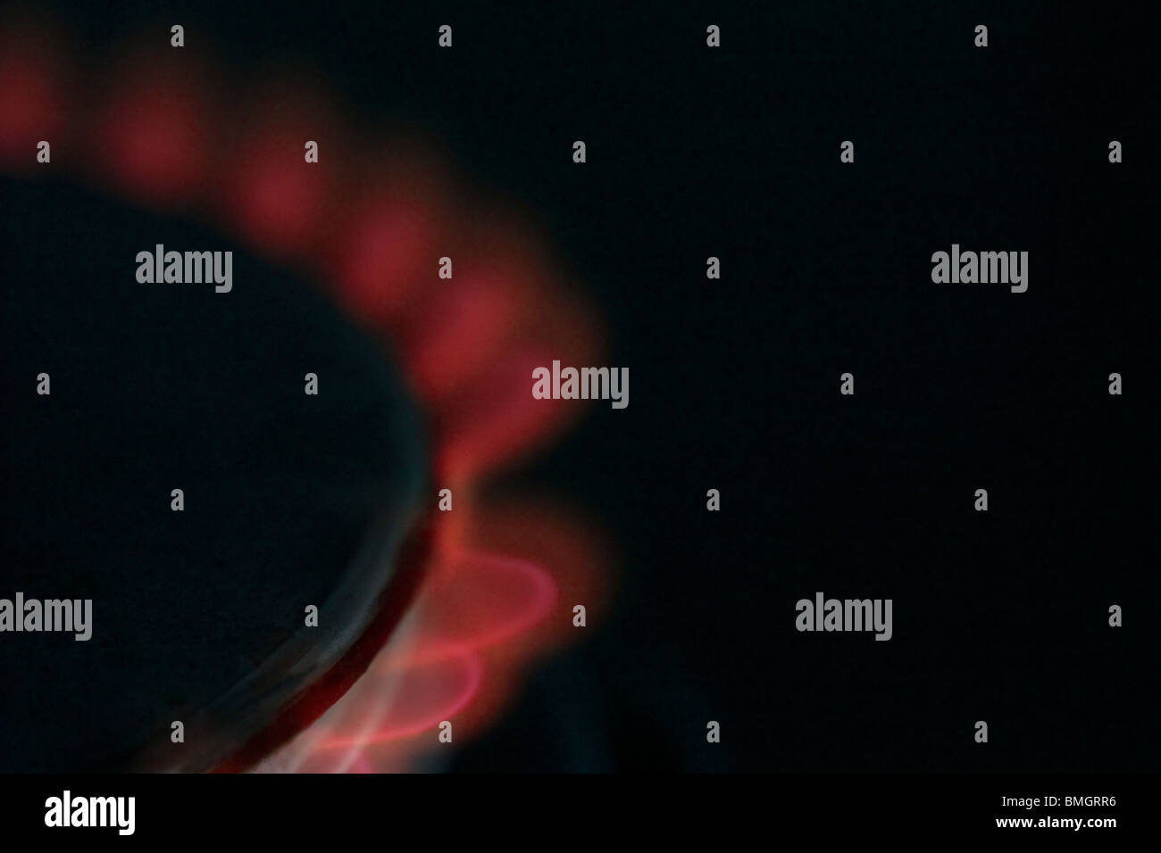 Red flame, indicating high cost of gas/fuel, from domestic gas cooker