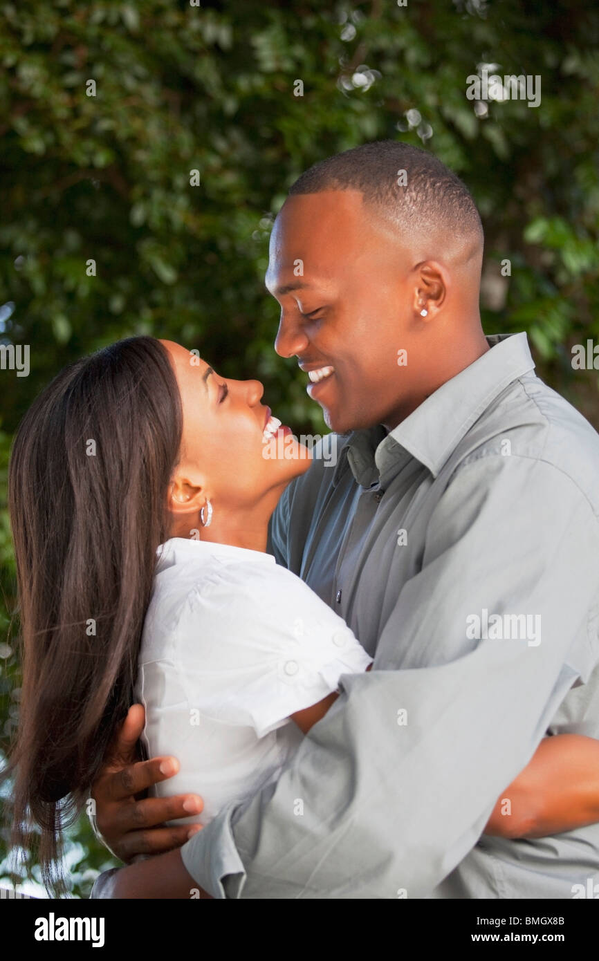 Black couple embrace holding hi-res stock photography and images - Alamy