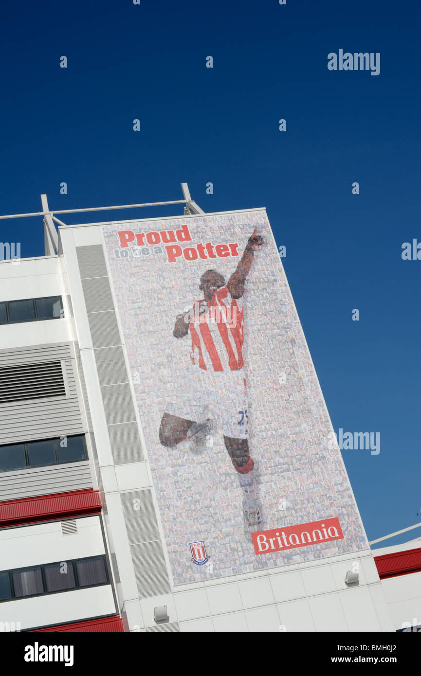 Massive banner covering the side of the Britannia Stadium home of Stoke City FC featuring Stoke player with words Proud Potter Stock Photo