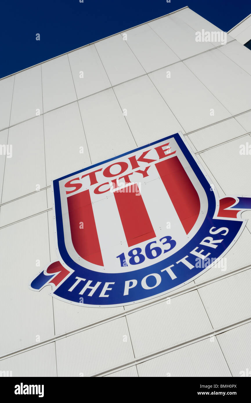 Stoke City FC badge, The Potters, on the side of the Britannia Stadium set against a clear blue