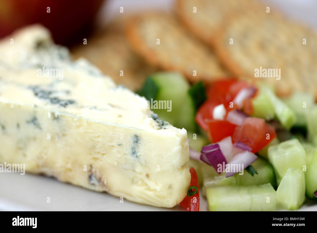 Health Colourful Dessert Plate Of Aromatic Stilton Cheese with Biscuits In Close Up With No People Stock Photo