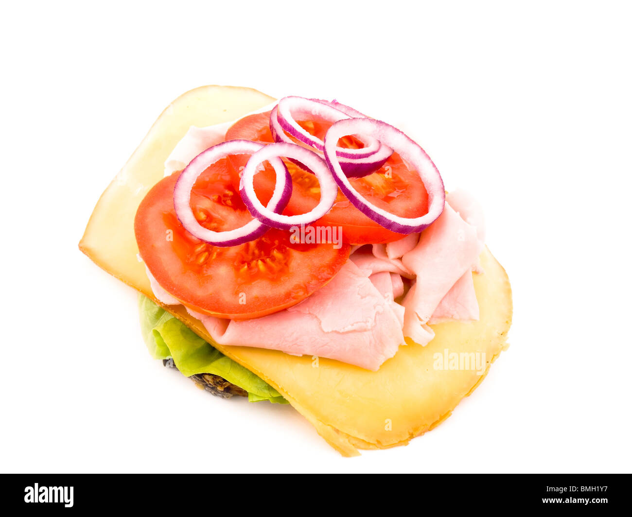 Granary bread with lettuce, smoked cheese, crumbled ham, sliced tomato