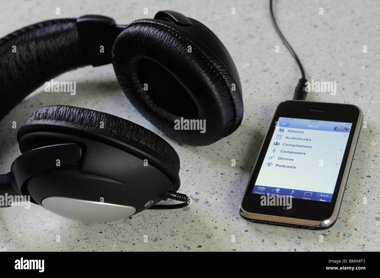 iphone plugged into a pair of headphones Stock Photo Alamy