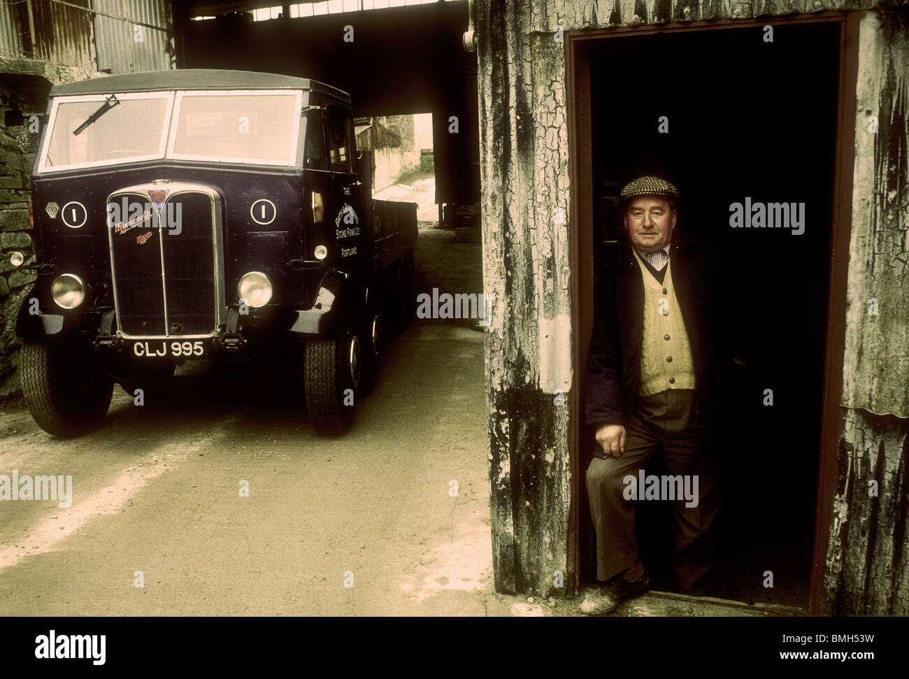 Driver by his 1936 AEC Mammoth Major eight wheeler truck Stock Photo