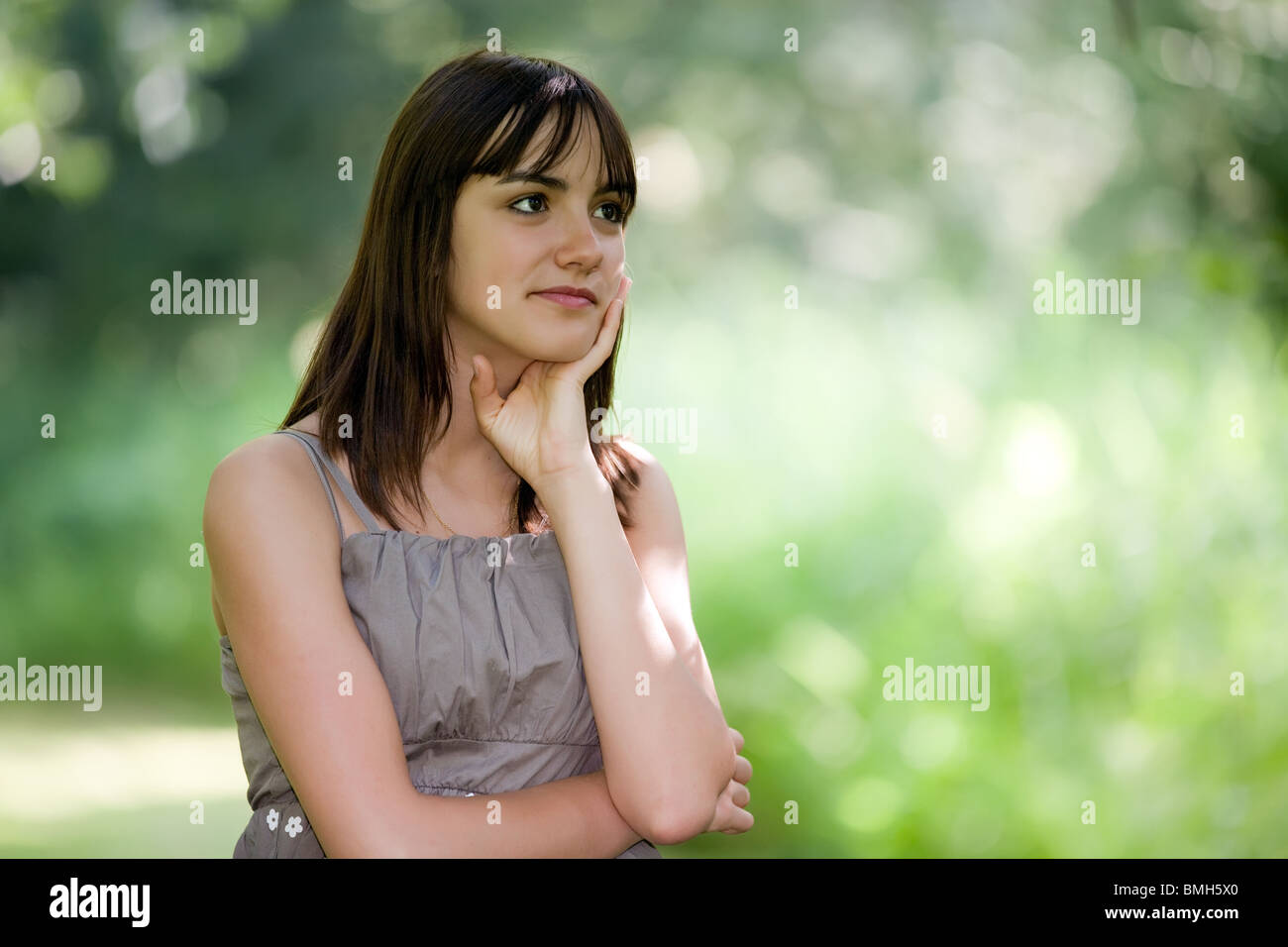 outdoor pensive teen girl portrait in nature Stock Photo