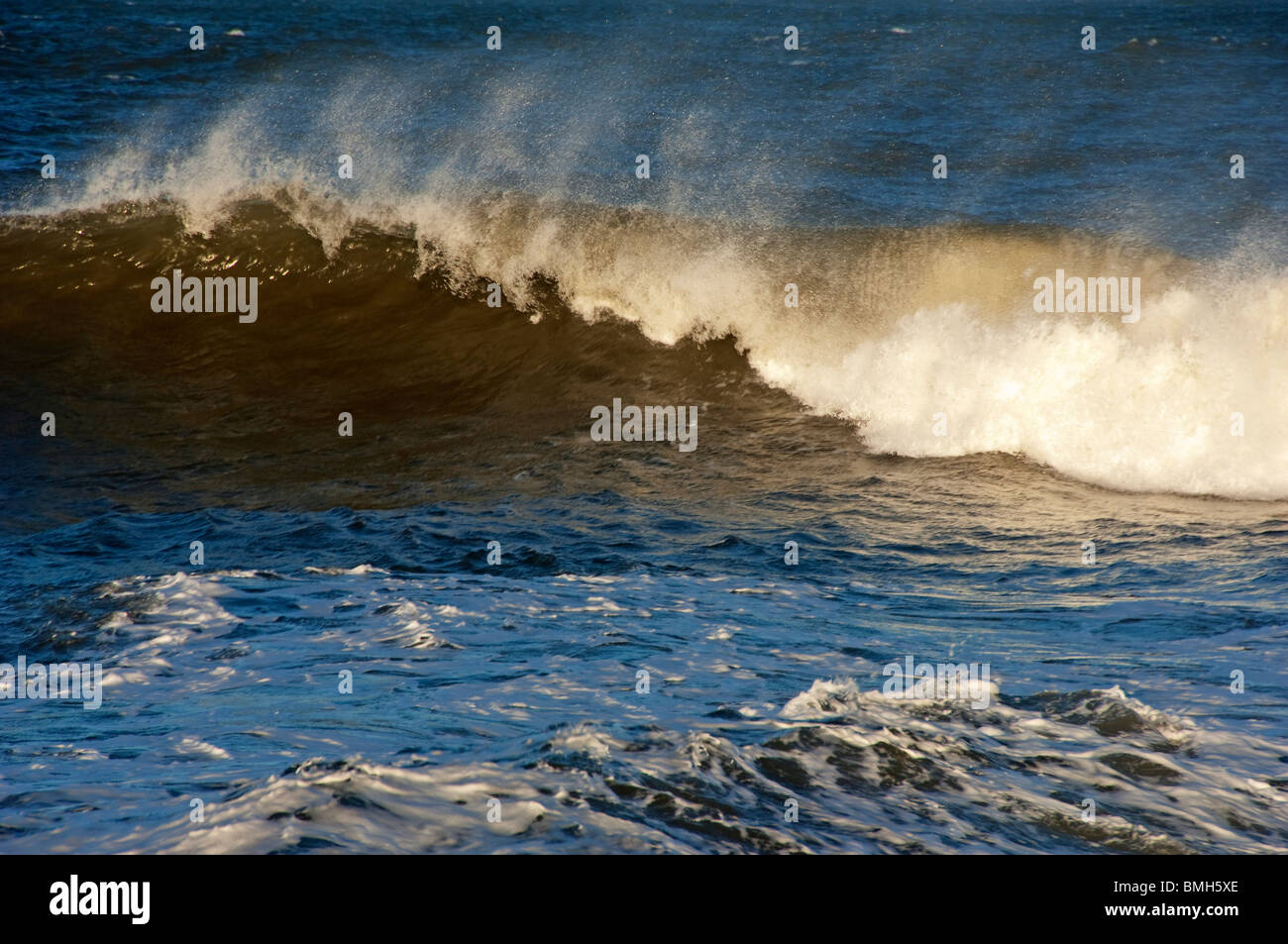 Rough seas, Bamburgh beach, Northumberland, England UK Stock Photo