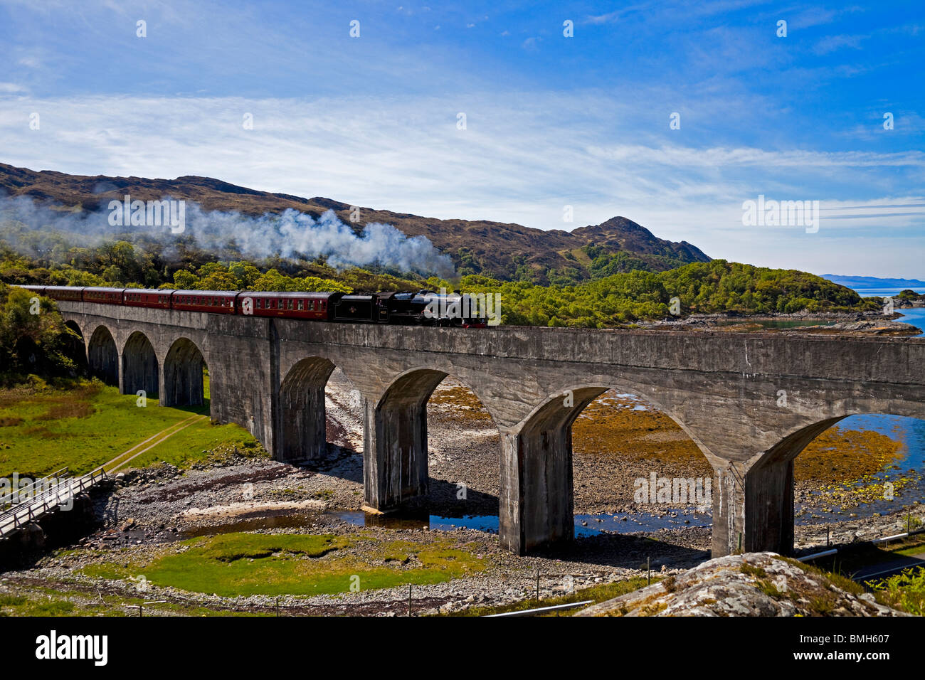 Jacobite Steam Train crossing Loch nan Uamh viaduct, Lochaber Scotland UK Europe Stock Photo